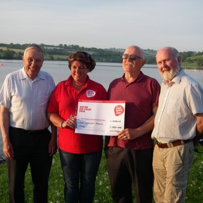 BAC Joe McCandless, President and Joe Curran Secretary watch on as Wilson Clinghan, representing the Club's competition anglers make a charity donation to Kim Colhoun, Chest, Heart and Stroke Association at Corbet Lough on 31 May 2018 