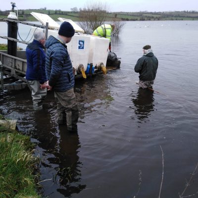 BAC - Henry McKnight oversees a fish stocking at Corbet Lough on 17 March 2020