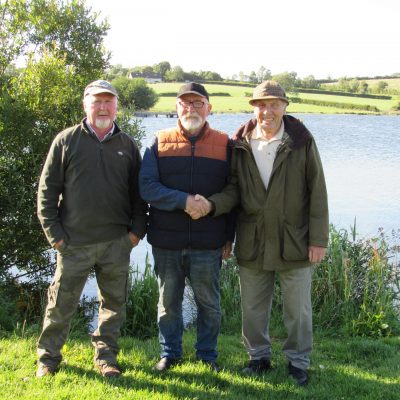 BAC - Corbet Lough Open Boat Fly Fishing Competition 25 June 2022. Joe McCandless, Club President and Joe Curran, Club Secretary congratulate Wilson Clinghan, Winner.