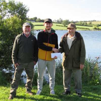 BAC - Corbet Lough Open Boat Fly Fishing Competition 25 June 2022. Joe McCandless, Club President and Joe Curran, Club Secretary congratulate Patrick Curran 2nd.