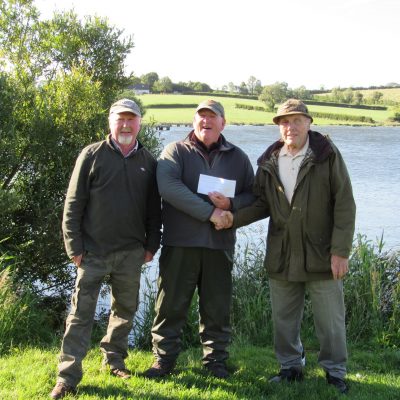 BAC - Corbet Lough Open Boat Fly Fishing Competition 25 June 2022.  Joe McCandless,Club President and Joe Curran Club Secretary congratulate Stevie Rea 3rd.  
