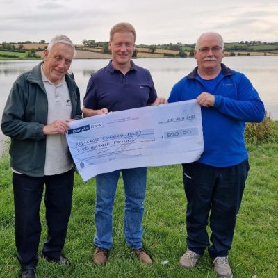 BAC - Corbet Lough Open Boat Fly Fishing Competition 2022. Joe McCandless, President and Sam Watt, Chairman present a cheque for £500 to Richard Watters, Red Cross for the Ukraine Crisis Fund at the Corbet Lough on 25 August 2022.