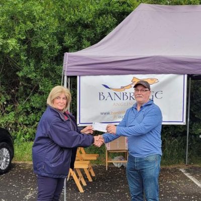 BAC - Sam Watt makes a Club donation of £200 to the RNLI at the Corbet Lough on 13 June 2024 