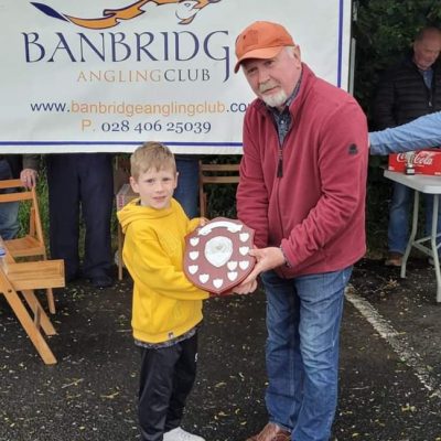 BAC - Joe Curran presents Xavier Mackle with the Junior Angler of the Year Shield for 2023 at the Corbet Lough on 13 June 2024