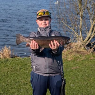 BAC - Riley Craig with an over-wintered Rainbow of almost 4,5lbs caught at the Corbet Lough on 9 March 2025