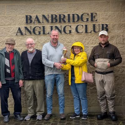 BAC = Linda McCandless Cup on the River Bann on Easter Monday 21 April 2025. L-R Joe McCandless, Club President Wilson Clinghan 2nd, Roger McClements 1st, Dr Jacqueline Rippington presenting the Cup and Connor Branniff 3rd 