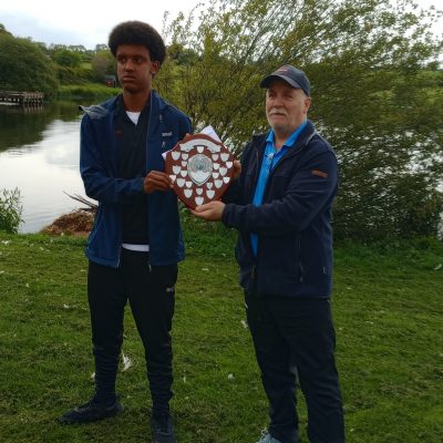 BAC - Sam Watt, Chairman presents Khalid Hassan Noor with the Juvenile Angler of the Year Shield for 2024 at the Club's Prize Distribution Evening at the Corbet Lough on 28 May 2025
