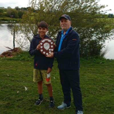 BAC - Sam Watt, Chairman presents Elijah Parks with the Junior Angler of the Year Shield for 2024 at the Club's Prize Distribution Evening at the Corbet Lough on 28 May 2025