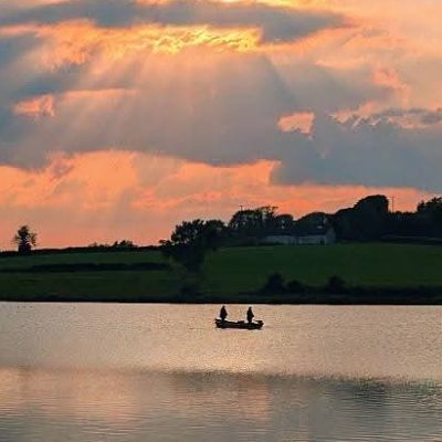 BAC - Boat anglers fishing the Corbet Lough at dusk in June 2025