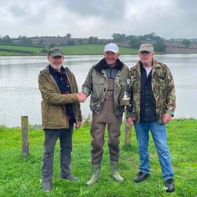 BAC - Richard and Michael Hanlon presenting their grandfather Howard Hanlon's Cup to the winner Lenny Murray at the Corbet Lough on Saturday 29 August 2026. 